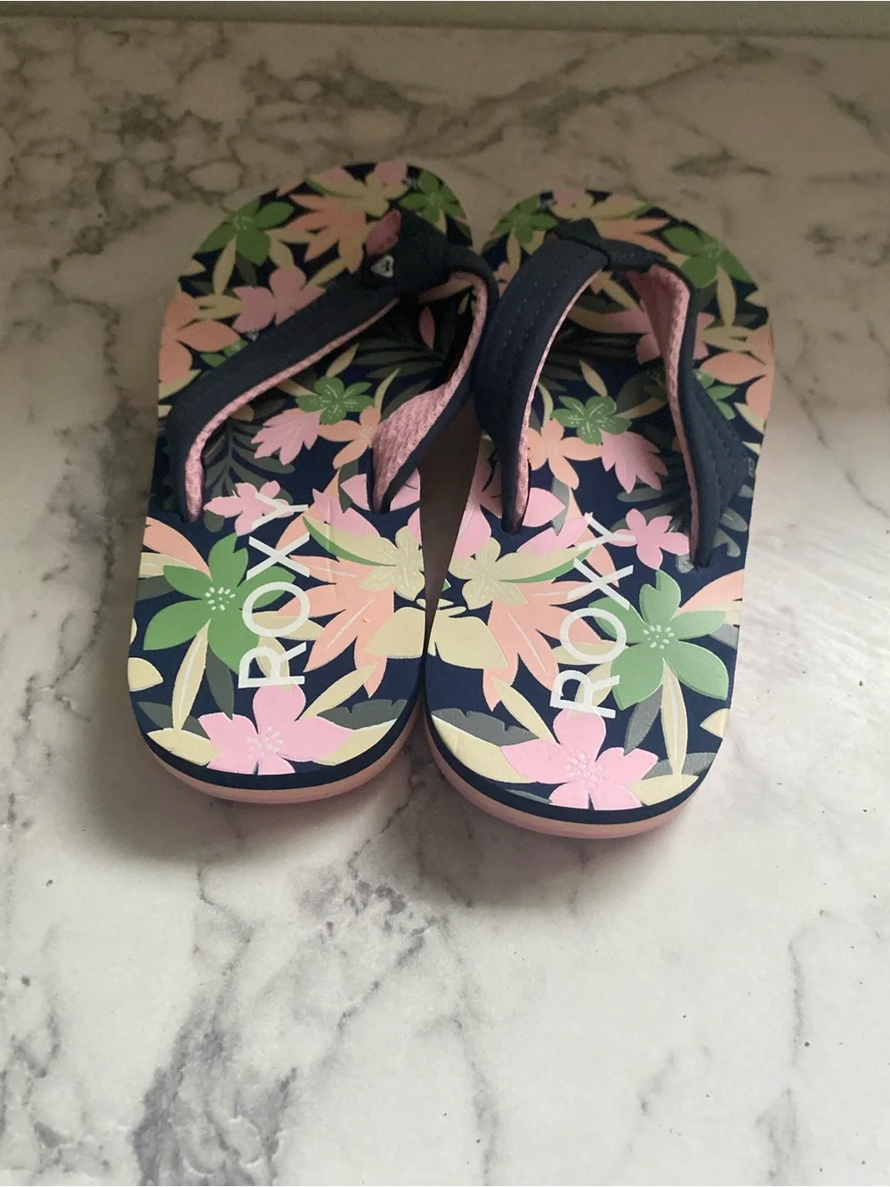 Roxy Girls' Floral Navy Flip Flops with Pink & Green Accents